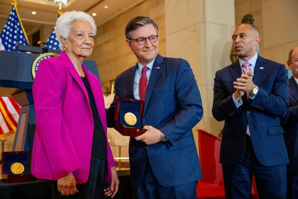 House Minority Leader Hakeem Jeffries (right) applauds as House Speaker Mike Johnson poses with Wanda Jackson (left) while accepting a Congressional Gold Medal on behalf of Mary Jackson during a ceremony on Capitol Hill on Wednesday.