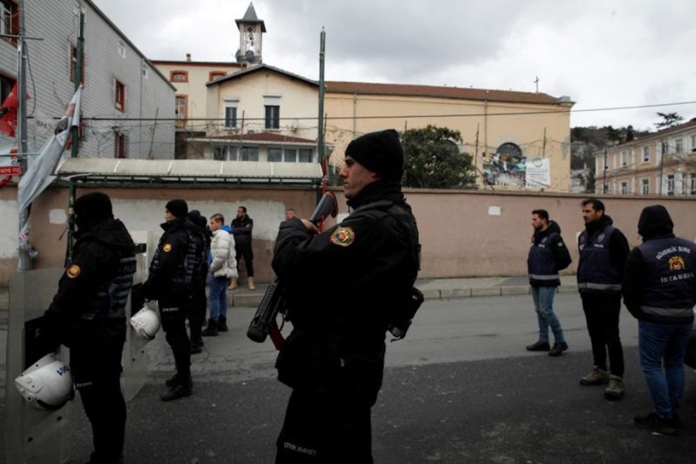 Turkish police stand guard outside St. Mary's Italian Catholic Church after two masked gunmen shot dead a person during Sunday service, in Istanbul, Turkey, on January 28, 2024.