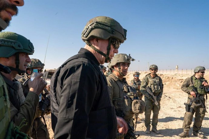 Israeli Defense Minister Yoav Gallant with military personnel on the ground