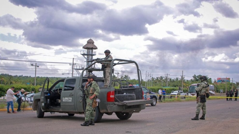 Mexican Army soldiers stand guard next to the area where five bodies were left in the street in Culiacán, Sinaloa state, Mexico, on September 21, 2024.