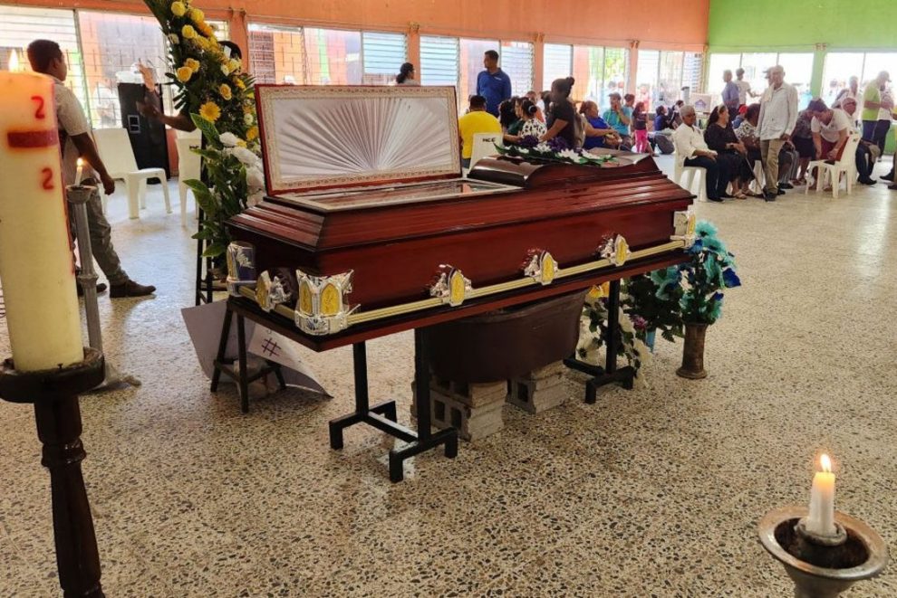 A resident attends the wake of the late environmentalist Juan López, who was shot dead in Tocoa, Colon Department, Honduras, on September 15, 2024. Honduran environmentalist and political activist Juan López, who was shot dead on Saturday, knew his life was in danger because of his fight for the protection of forests and his rejection of mining exploitation.