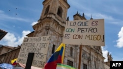 People take part in a demonstration called by unions in support of Colombian President Gustavo Petro's pension reforms, at Plaza Bolivar in Bogota on September 19, 2024. (Photo by Alejandro Martinez / AFP)