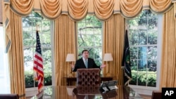 White House Historical Association President Stewart McLaurin shows members of the media around a replica of the Oval Office as it stands today, Monday, Sept. 16, 2024, in Washington.