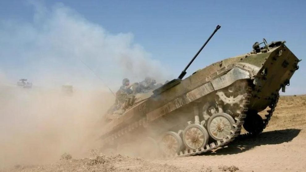 A Russian soldier maneuvers a tank in this file image.