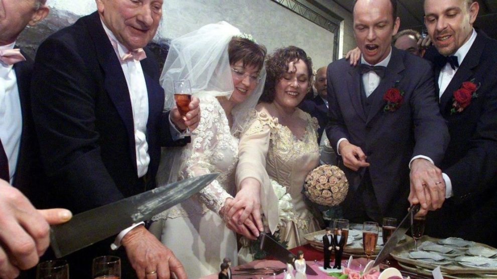 Gay couples cut a wedding cake in Amsterdam on April 1, 2001, after the Netherlands passed the first same-sex marriage law.