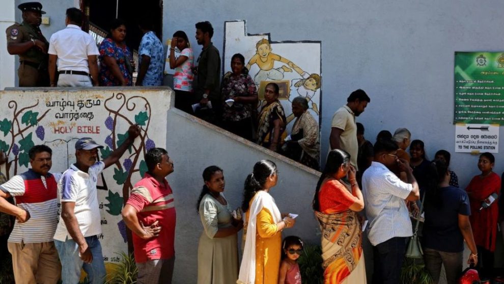 Voters queue outside a polling station to cast their ballot in the 2024 presidential election, in Colombo, Sri Lanka, September 21, 2024.