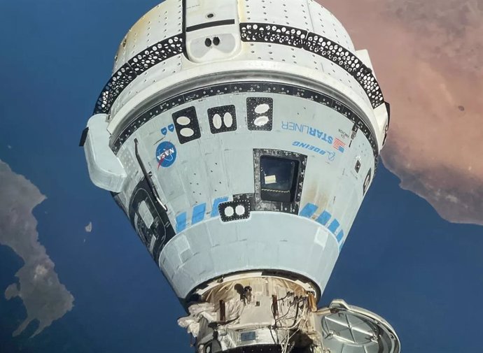 File - Starliner spacecraft docked at the International Space Station