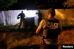 Secret Service and Homeland Security agents search the former home of Ryan W. Routh in Greensboro, North Carolina, as the FBI investigates an apparent assassination attempt in Florida on Donald Trump, Sept. 15, 2024.