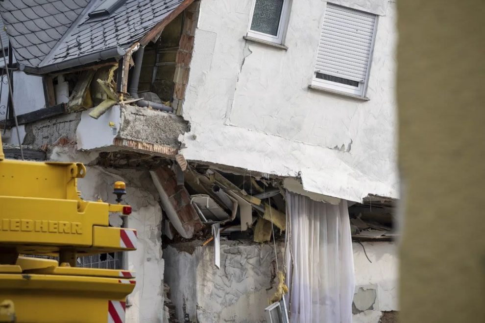 A badly damaged wall in a partially collapsed hotel.