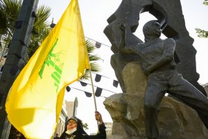 A woman with a Hezbollah flag in Tehran, Iran. EP