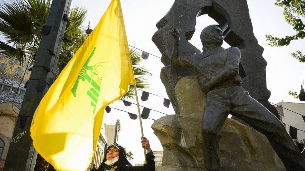 A woman with a Hezbollah flag in Tehran, Iran. EP