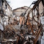 File - Archive image of a destroyed house in Kherson.