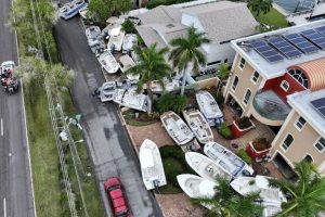 Boats displaced by Hurricane Helene in front of homes on Treasure Island, Florida, on Saturday. Joe Raedle/Getty Images