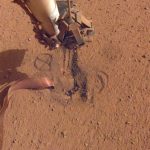 File - NASA's InSight retracted its robotic arm on October 3, 2020, revealing where the "mole" spike-shaped is trying to dig into Mars.