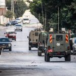 Israeli Army trucks in the West Bank city of Nablus