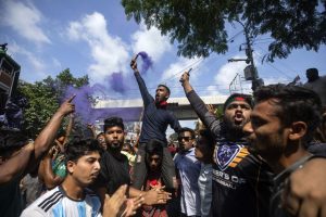 Protesters shout slogans in Dhaka, the capital of Bangladesh, on Monday.