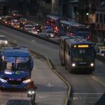 Cars circulate in the middle of a blackout in Quito, on June 19, 2024.