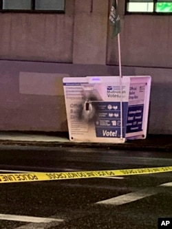 This image released by the Portland Police Bureau shows a ballot box after an incendiary device was discovered inside it, in Portland, Oregon, on October 28, 2024.