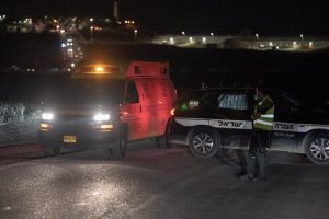 Ambulances and police cars following a Hezbollah drone attack on a military base in Binyamina, Israel