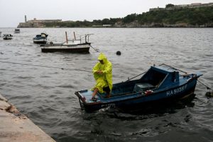 A man works to secure his boat due to Tropical Storm Helene in Havana on September 25, 2024.