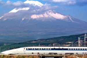 A Shinkansen train speeds past Mt.