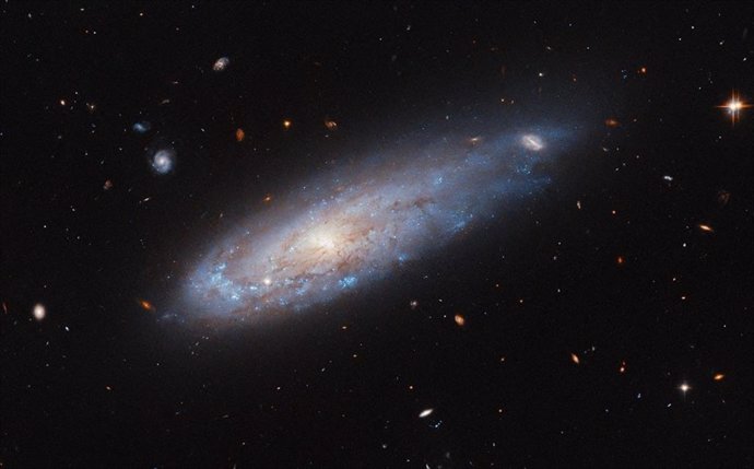 This image from the NASA/ESA Hubble Space Telescope shows the spiral galaxy IC 3225.