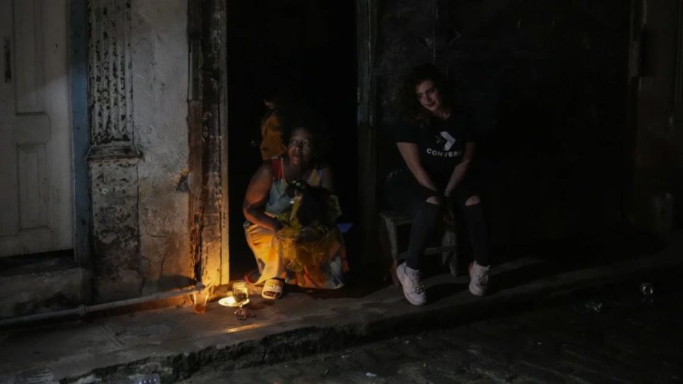 Residents pass the time during a blackout following the failure of a major power plant in Havana, Cuba, on Saturday, October 19, 2024.