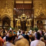 A group of people visit the mausoleum of Christopher Columbus at the cathedral in Seville, Spain, on October 11, 2024.