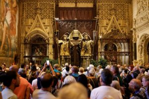 A group of people visit the mausoleum of Christopher Columbus at the cathedral in Seville, Spain, on October 11, 2024.