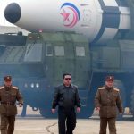 In this photo distributed by the North Korean government, North Korean leader Kim Jong Un walks around what he says is a Hwasong-17 intercontinental ballistic missile (ICBM) on the launcher, at an undisclosed location in North Korea on the 24th. March 2022.