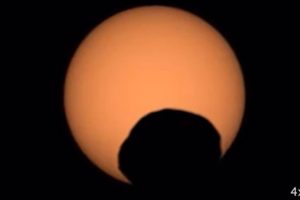 NASA's Perseverance rover captured the silhouette of the Martian moon Phobos as it passed in front of the Sun on September 30, 2024.