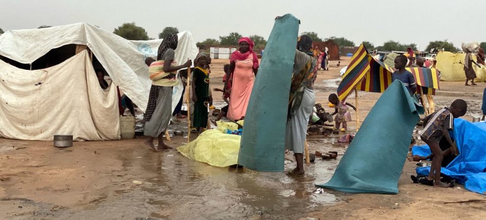 Sudanese refugees build makeshift shelters during the rainy season in Adre, eastern Chad.