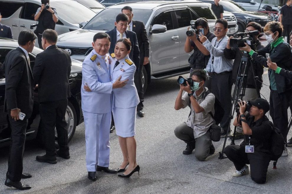 Paetongtarn Shinawatra hugs his father Thaksin Shinawatra as they arrive at the royal endorsement ceremony in Bangkok, Thailand, on August 18, 2024.