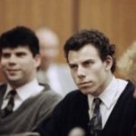 Lyle Menendez, left, and Erik Menendez are seen sitting next to defense attorney Leslie Abramson, right, in Beverly Hills Municipal Court during a hearing on Nov. 26, 1990. (AP Photo/Nick Ut, File) )