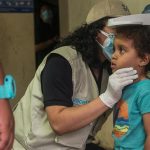 A girl receives medical assistance at a shelter in El Paraíso, Honduras.