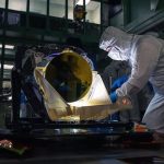 The LISA telescope prototype undergoes post-delivery inspection in a dark clean room at NASA's Goddard on May 20.