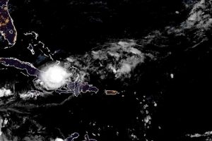 Tropical Storm Oscar brings strong winds and rain to eastern Cuba on its way to the Bahamas