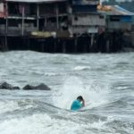 A resident swims despite strong waves caused by Tropical Storm Trami in Manila, Philippines, on October 23, 2024.