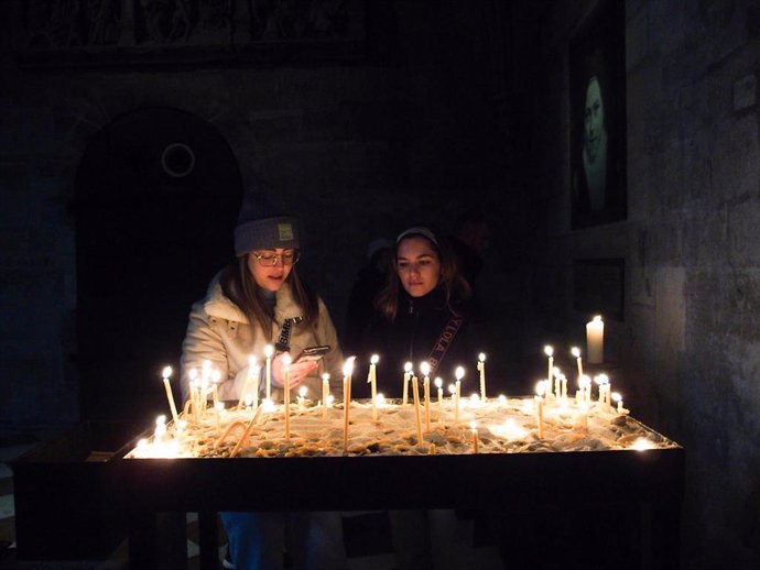 File - February 24, 2024, Vienna, Vienna, Austria: Children light candles inside the St. Stephan Church in Stephanplatz in Vienna. People gathered together to commemorate the 2 year anniversary of the unprovoked attack on Ukraine. .On February 24, 2022