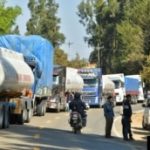 Trucks remain stopped on both sides of the road during a road blockade organized by supporters of former Bolivian President Evo Morales against President Luis Arce's government, in Epizana, Bolivia, October 17, 2024. REUTERS/Patricia Pinto