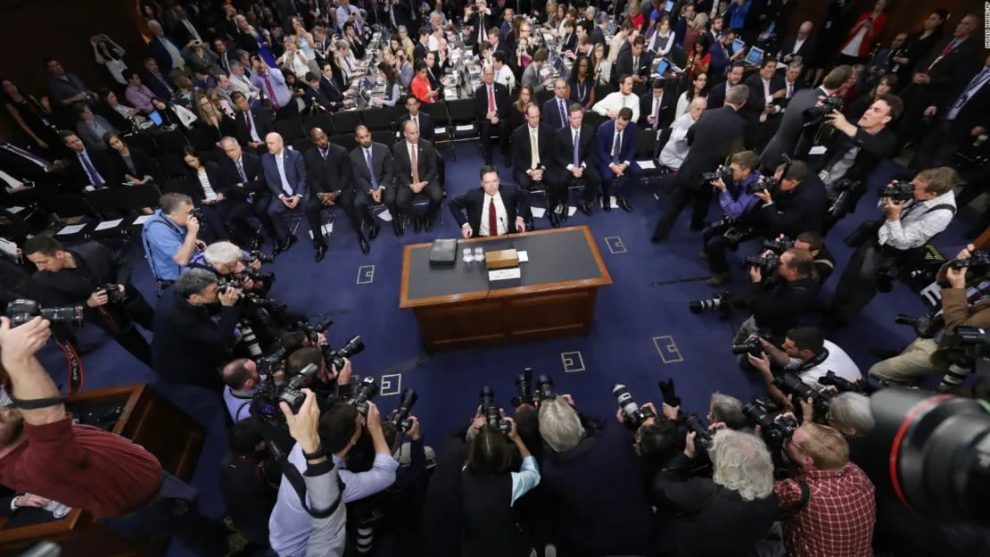 Former FBI Director James Comey takes his seat at the beginning of the Senate Intelligence Committee hearing in Washington, June 8, 2017.