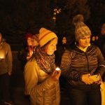 Friends hold candles as they remember Mackenzie Michalski, a 31-year-old American tourist who died while on vacation, during a candlelight vigil in Budapest, Hungary, on Nov. 9, 2024.