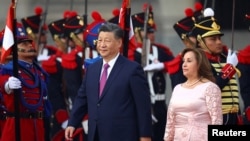 Chinese President Xi Jinping is received by the President of Peru, Dina Boluarte, at the Government Palace, within the framework of the Asia-Pacific Economic Cooperation (APEC) summit, in Lima, Peru, on November 14, 2024.