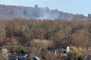 Firefighters fight fires on both US coasts