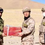 Indian and Chinese soldiers exchange sweets as part of overcoming the border conflict