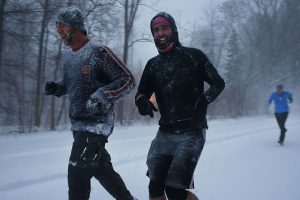 NEW YORK, NY - JANUARY 23: Men jog in blizzard-like conditions on January 23, 2016 in the Brooklyn borough of New York City. The Northeast and parts of the South are experiencing heavy snow and ice from a slow moving winter storm. Multiple deaths from traffic accidents have already been reported as the storm makes its way up the coast. (Photo by Spencer Platt/Getty Images)