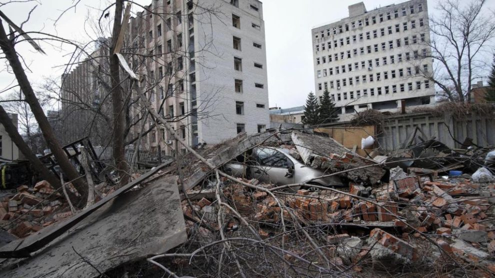 A car crushed by the rubble of buildings bombed by Russia, in the administrative center of the city of Kharkiv.