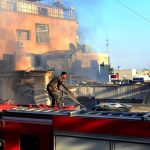 A member of the rescue teams in a building destroyed by an Israeli bombardment against the Syrian capital, Damascus (file)