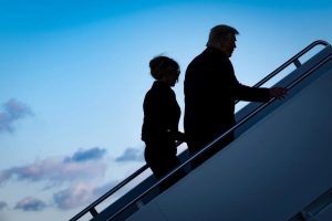 In this Jan. 20, 2021 photo, then-President Donald Trump and first lady Melania Trump board Air Force One at Joint Base Andrews in Maryland. Pete Marovich/Pool/Getty Images