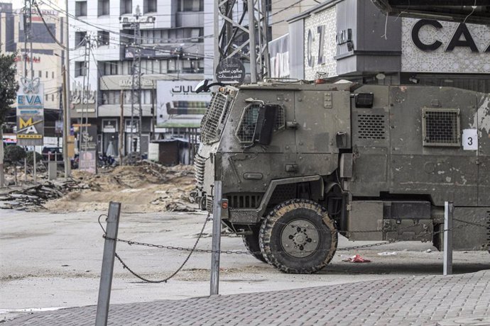 Israeli Army vehicle travels through the streets of Jenin, in the West Bank